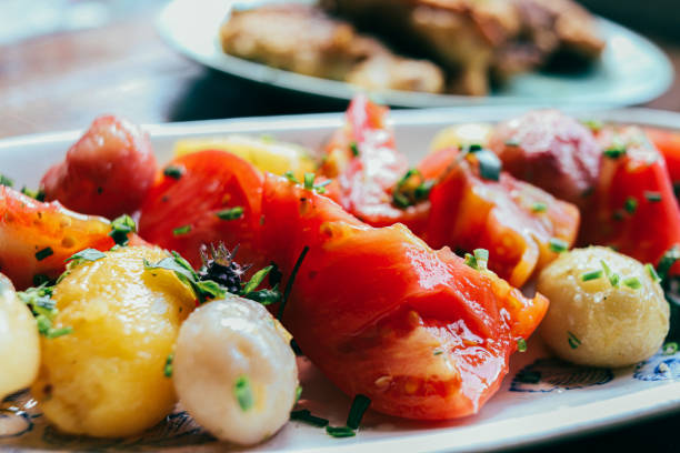 Boiled potato and fresh tomato salad on a plate