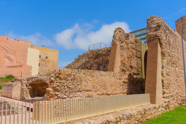 Tarragona, Spain - July 14, 2024: Roman Circus remains and modern buildings in Tarragona.