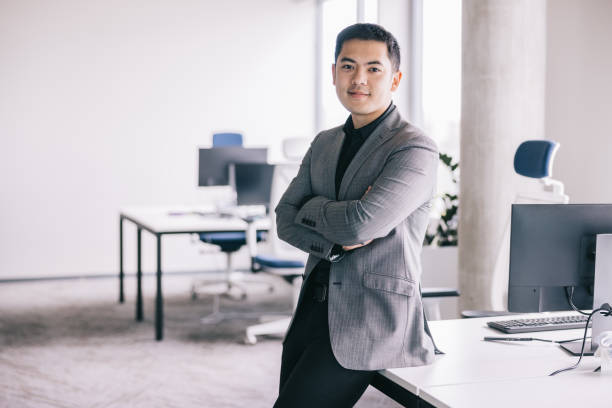 istock Confident Asian businessman in modern office room 2164345801
