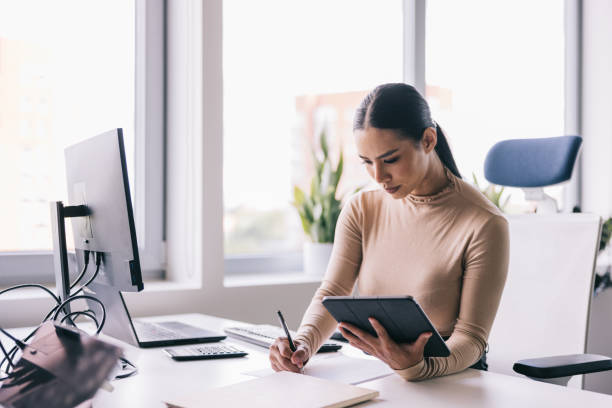 istock Woman working with digital tablet at the office 2164345842