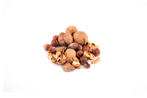 istock group of nuts on a white background. walnuts, hazelnuts, cracked walnuts, cracked hazelnuts, walnut shells, walnut kernels 2164347125