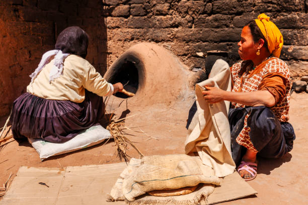 istock Moroccan women baking bread - khubz 2164347886