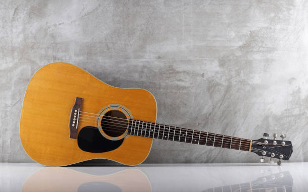 istock Musical instrument - Front view vintage acoustic guitar with a reflection 2164350665