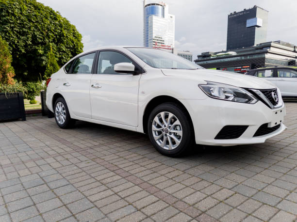 Minsk, Belarus, July 30, 2024 - Front view white car Nissan Sylphy in city