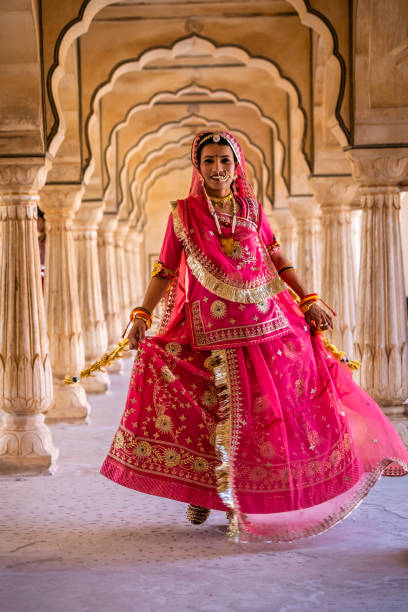 istock Young Indian woman posing in Jaipur 2164354214