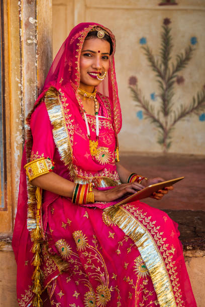 istock Young Indian girl using a digital tablet in Jaipur city 2164354579