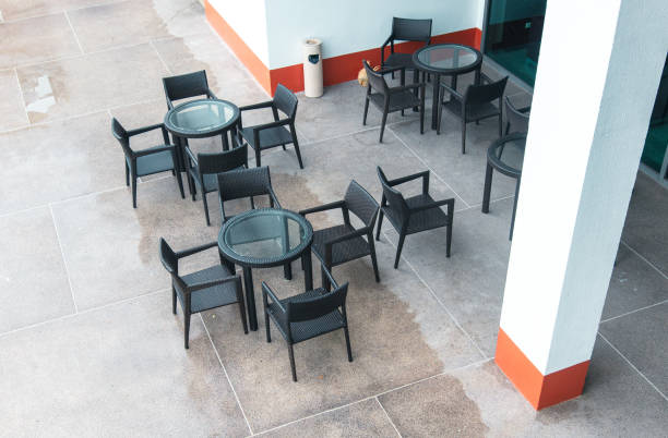 istock Tables and chairs in a street cafe 2164355069