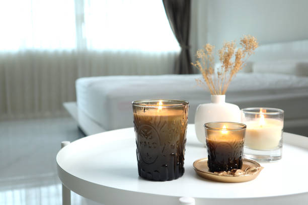 istock luxury scented candles on the nice table in white bedroom creating relax ambient 2164356741