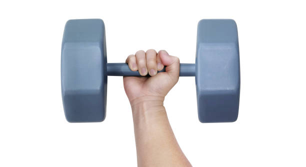 Tattooed middle aged bearded black man lifting weights at a gym