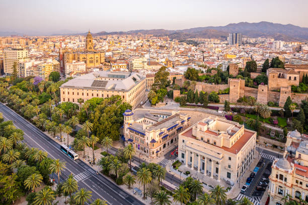 Aerial of Malaga old town skyline with the city hall, cathedral and the Alcazaba citadel taken at the golden hour Andalucia, Spain Drone view of Malaga old town skyline showing the city park, city hall, cathedral and the Alcazaba citadel taken at the golden hour Andalucia, Spain málaga province stock pictures, royalty-free photos & images