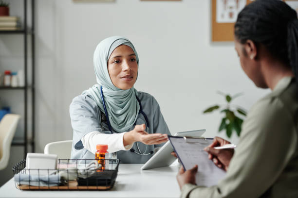 istock Doctor with tablet talking to patient 2164367790