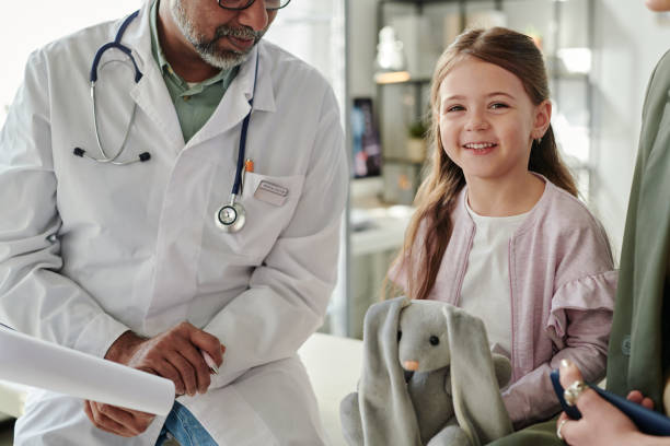 istock Cute cheerful patient visiting doctor 2164367859