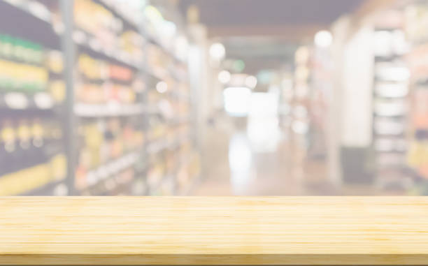istock Empty wood table top with supermarket blurred background for product display 2164370950