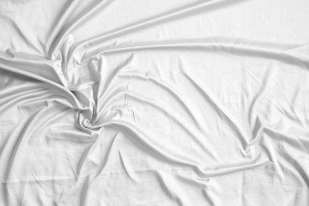 istock Abstract white wrinkled bedding sheet fabric texture background 2164372297