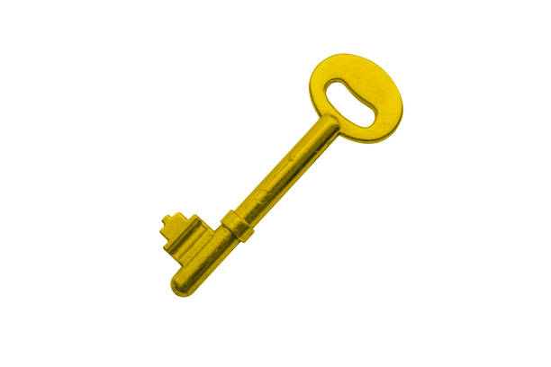 Close up of an old fashioned key stuck in a white key hole