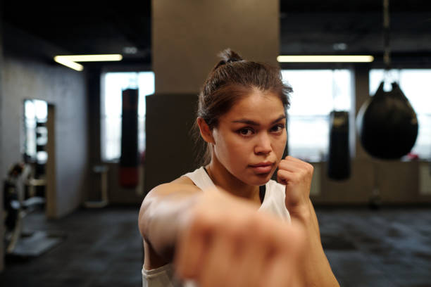 istock Boxer keeping clenched fist by her face 2164374840