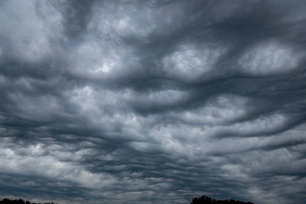 Dramatic sky with bubble clouds, drone point of view.