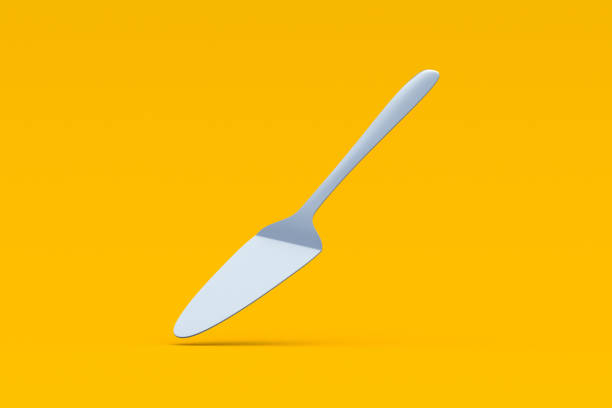 istock Falling cake spatula on orange background. Confectionery shovel. Kitchen utensil. 3d render 2164377173