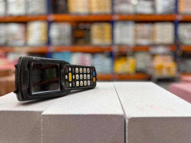 istock Warehouse Barcode Scanner on top of white silica bricks 2164379355