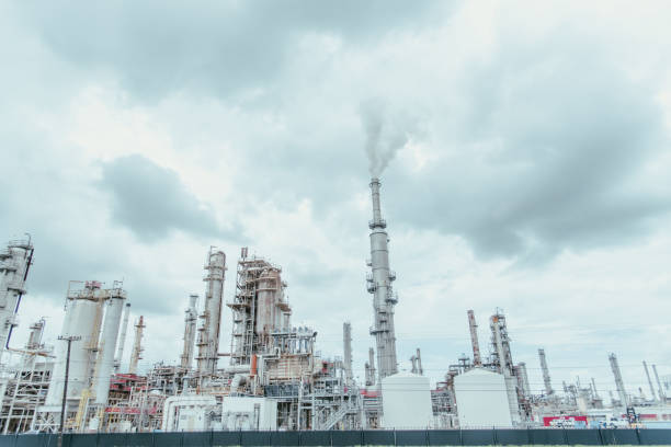 istock Oil cracking refinery complex with tankage, distillation unit, steam, power, water-treatment plants, gas flare or flare stack clouds of exhaust fumes in San Antonio, Texas, gasoline production 2164387070