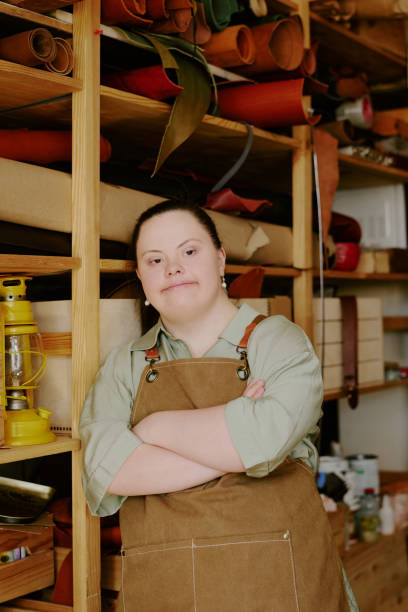 istock Talented Female Tailor with Down Syndrome in Atelier 2164388155