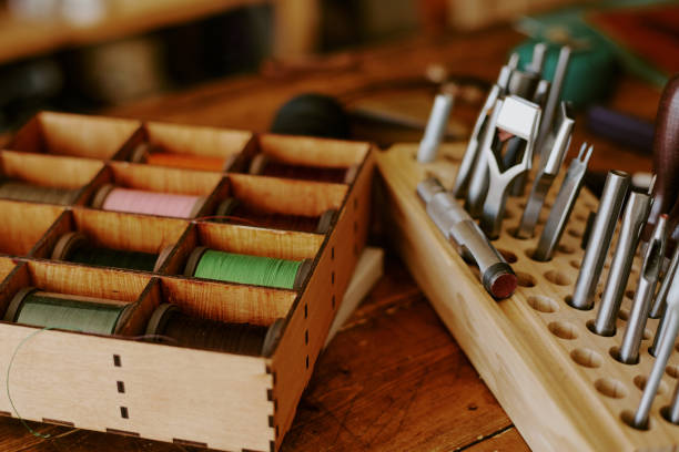 istock Wooden Box with Spools of Threads and Punch Nozzles 2164388197