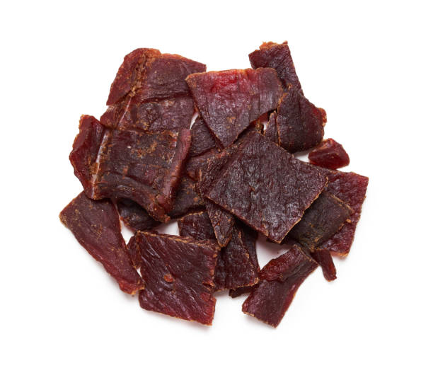 istock top view flat lay pile of beef jerky isolated on white background 2164392140