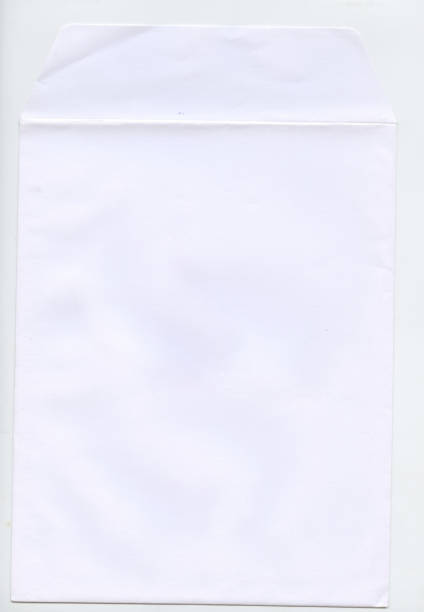 istock isolated shot of closed an old envelope on white background 2164398237