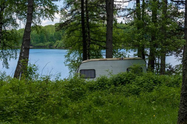 istock Abandoned camping trailers in the forest on Lake Vlasina. 2164401188