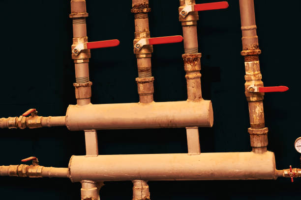 istock Pipes and water shutoff.Brown sewer water boiler system with pressure gauge 2164401708