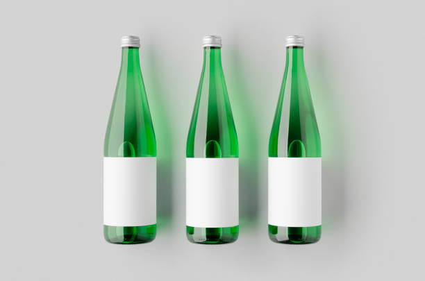 istock Green glass water bottle mockup with a blank label. 2164402332