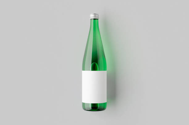 Green glass water bottle mockup with a blank label.