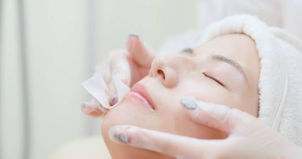 istock asian beautician help face cleaning 2164404503