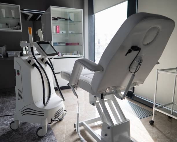 istock Empty beautician office with white couch and photorejuvenation machine. 2164404877