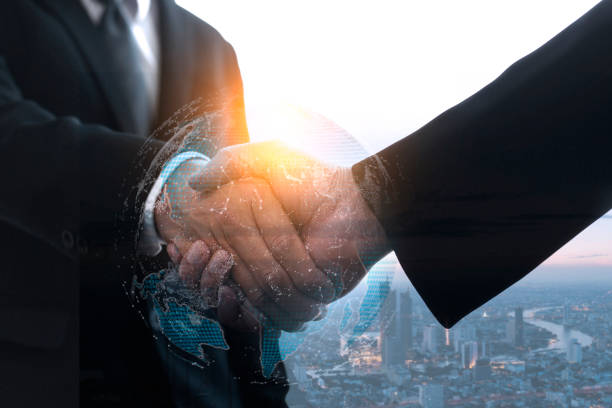 istock Global Business Handshake with Digital Overlay 2164405245