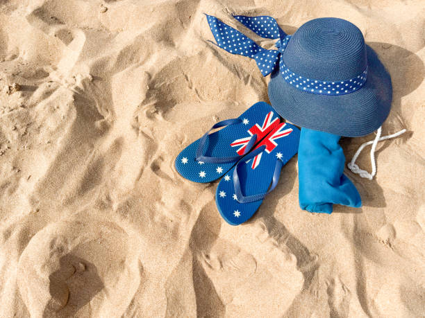 istock Beach Accessories on Sand - Hat, Flip Flops, Bag, and Shells for Summer Vacation 2164406101