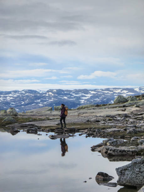 istock Exploring Norway's Serene Landscape at Dawn by a Reflective Mountain Lake 2164411345