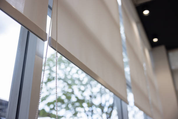 istock A window with white blinds and a chain hanging from the top 2164417451
