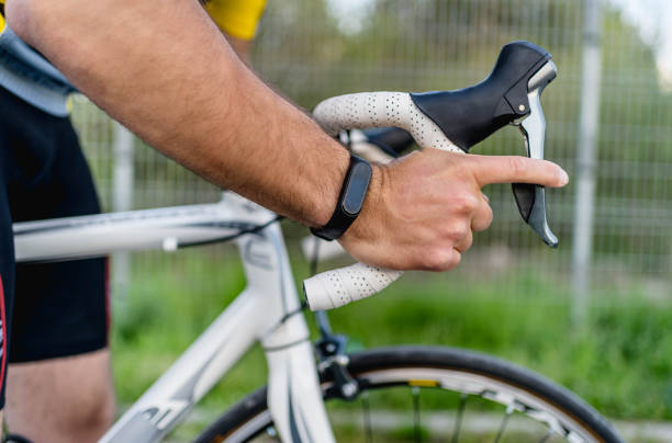 Man pulls the brake lever on the bicycle