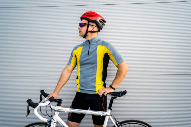 Young cyclist with his bike outdoors