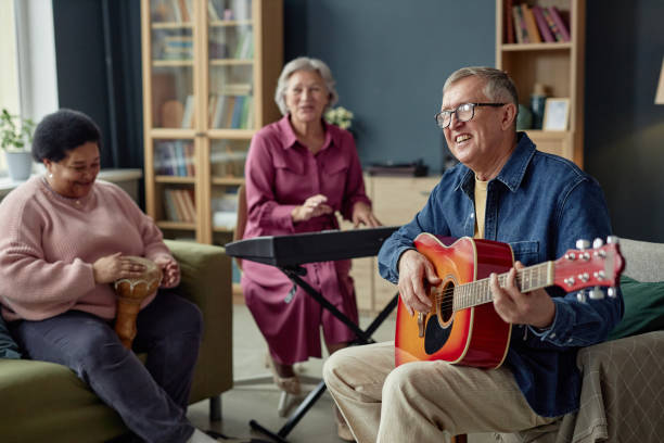istock Group of Joyful Mature People Playing Music 2164427140