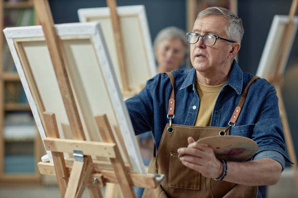 istock Creative Mature Man Painting 2164427161