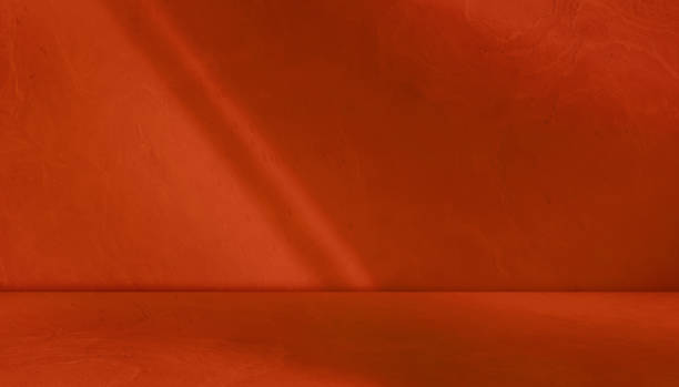 istock red background studio room with light beam from above for product display especially cosmetic or beauty products. floor and wall backdrop muslin design backdrop. 2164427401