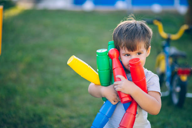 istock Little boy playing in backyard 2164427993