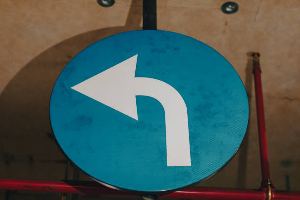 istock Mandatory left sign in a underground parking garage 2164429361