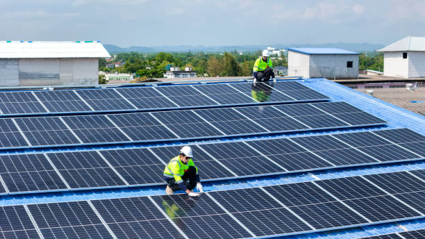 istock engineer man inspects construction of solar cell panel or photovoltaic cell by electronic device. Industrial Renewable energy of green power. factory worker working on tower roof. 2164430958