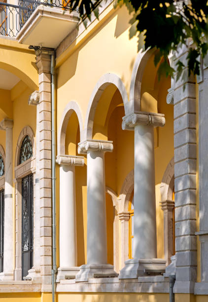 istock Yellow building with arched portico and white Ionic columns in Izmir, Turkey 2164434714