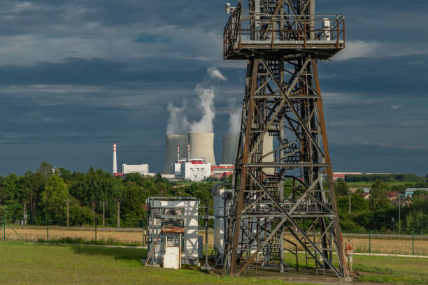 Nuclear power plant with grain fields and industrial tower in summer hot evening in Temelin CZ