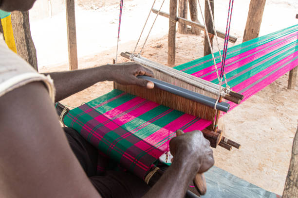 A person working with ropes to make a pattern