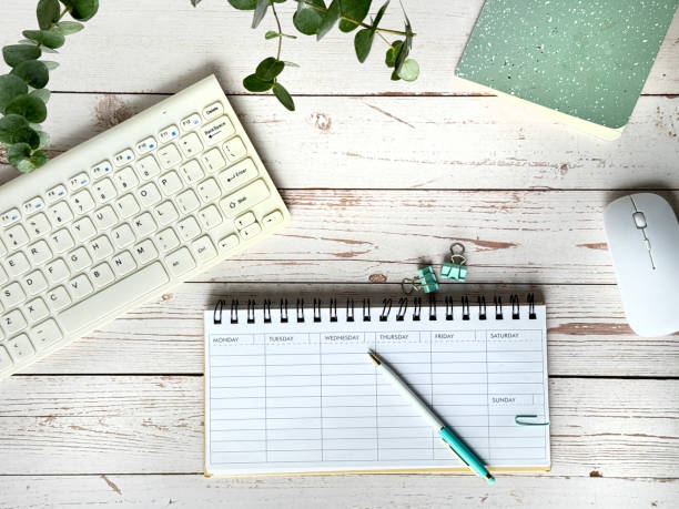istock A Desk With a Blank Weekly Planner, Keyboard, Mouse and Plant 2164436381